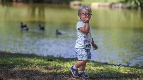 Ava Williams enjoys the weather Wednesday at Lake Avondale in DeKalb County. JOHN SPINK / JSPINK@AJC.COM.