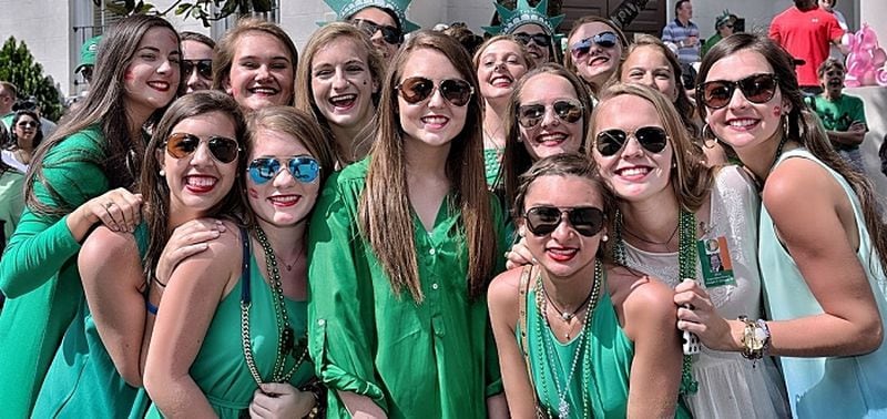Ladies pose for a picture at the St. Patrick's Day parade in Savannah, Georgia.