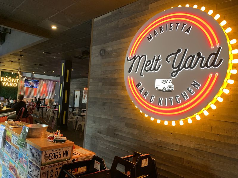 Marietta Melt Yard is a neighborhood eatery with a blend of a food truck, a carnival and a beer garden, according to managing partner Justin Wilfon. RODNEY HO/rho@ajc.com
