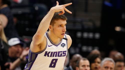 Sacramento Kings guard Bogdan Bogdanovic flashes three fingers after scoring a 3-point basket during the first quarter of the team's game against the Washington Wizards in Sacramento, Calif., Tuesday, March 3, 2020. (Rich Pedroncelli/AP)