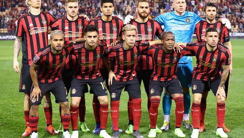 Feb. 28, 2019 Kennesaw: Atlanta United players pose for a team photo as they take the field to play C.S. Herediano in their Concacaf Champions League soccer match on Thursday, Feb. 28, 2019, in Kennesaw. Front from left: Josef Martinez, Pity Martinez, Ezequiel Barco, Darlington Nagbe, and Eric Remedi. Back from left: Brek Shea, Julian Gressel, Miles Robinson, Leandro Gonzalez Pirez, Brad Guzan, and Michael Parkhurst.    Curtis Compton/ccompton@ajc.com