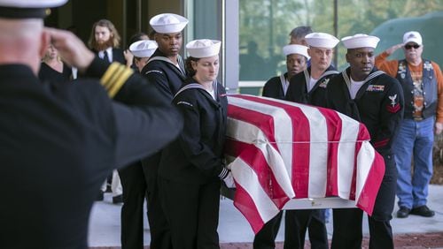 Navy personnel carry the casket of Cameron Walters, 21, of Richmond Hill, after his funeral service in Savannah last month. Walters was one of the three sailors killed in the Dec. 6 shooting at Naval Air Station Pensacola. (AJC Photo/Stephen B. Morton)
