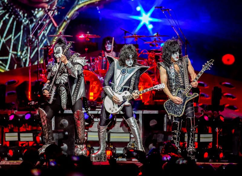 (From left) Gene Simmons, Paul Stanley and Tommy Thayer (Eric Singer in background) provided more than two hours of stomping rock 'n' roll at State Farm Arena on April 7, 2019. Photo: Ryan Fleisher/Special to the Atlanta Journal-Constitution