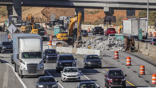 Work on the new I-285 interchange at Ga. 400 will continue into 2024. (File photo by John Spink / John.Spink@ajc.com)