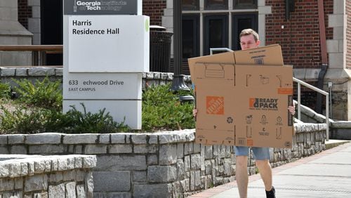 March14, 2020 Atlanta - Georgia Tech student Mason Harrell holding moving boxes heads his dormitory to prepare to move out on Georgia Tech campus on Saturday, March 14, 2020. (Hyosub Shin / Hyosub.Shin@ajc.com)