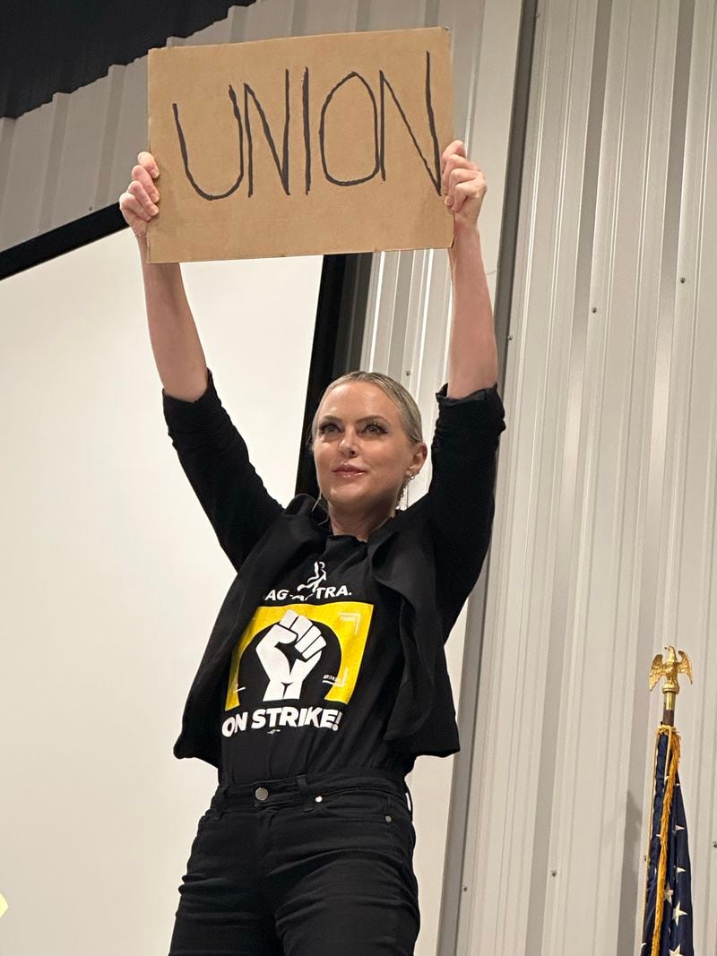 Atlanta actress Elaine Hendrix ("The Parent Trap," "Dynasty") said she consciously channeled "Norma Rae" by standing on a desk and holding up the world "UNION." RODNEY HO/rho@ajc.com