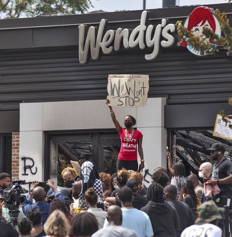 Protesters at Wendy’s on University Avenue on June 14. Protesters set fire to the Atlanta Wendy’s the day after Rayshard Brooks, a 27-year-old Black man, was fatally shot by Atlanta police. (STEVE SCHAEFER FOR THE ATLANTA JOURNAL-CONSTITUTION)