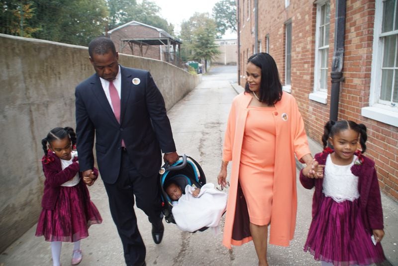 Mayoral candidate Ceasar Mitchell with Czarya, 5, baby Ceasar III, 18 weeks, wife Dr. Tiffany Mitchell and Canon, 6, after voting on Tuesday morning. Photo: Nick Nelson