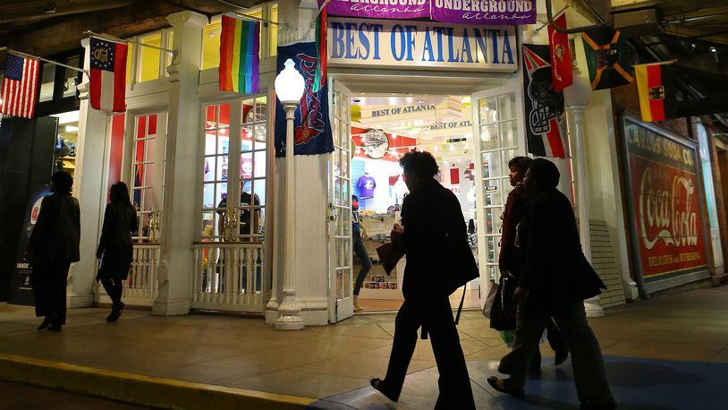 Visitors and shoppers walk past the Best of Atlanta store in Underground Atlanta on Wednesday, March 19, 2014, in Atlanta. Mayor Kasim Reed has vowed to sell the struggling downtown shopping and entertainment complex to a private developer. CURTIS COMPTON / CCOMPTON@AJC.COM