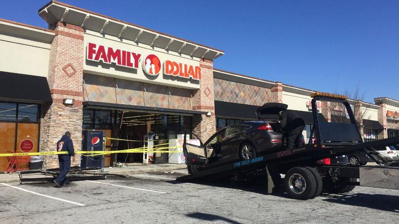 A Hyundai Sonata crashed into the Family Dollar store on Rockbridge Road on Saturday afternoon. (Credit: Channel 2 Action News)
