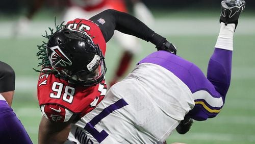 Falcons defensive end Takkarist McKinley sacks Vikings quarterback Case Keenum during the second quarter in a NFL football game on Sunday, December 3, 2017, in Atlanta.  Curtis Compton/ccompton@ajc.com