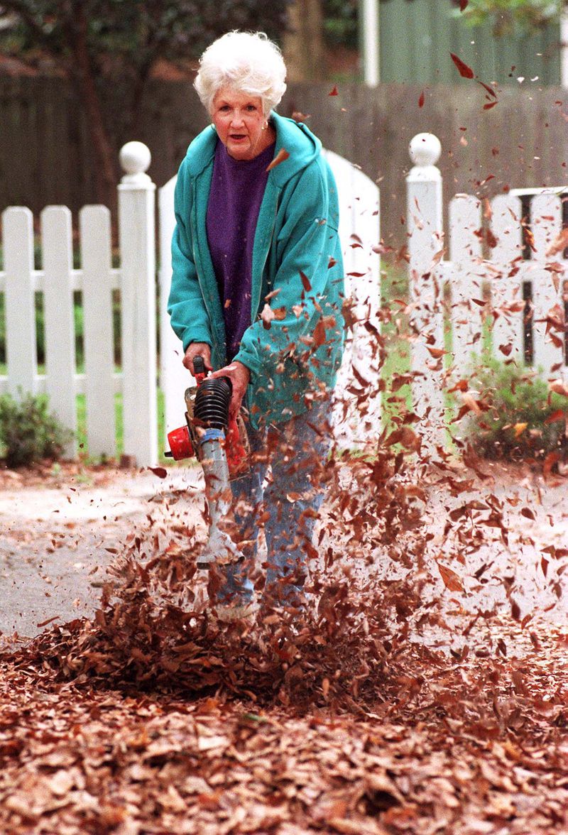 In Marietta, Georgia, Judy Bell was busily fighting the battle of autumn leaves back in 1997. (ANDY SHARP / AJC FILE)