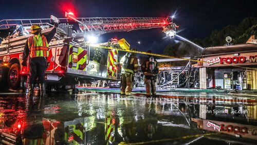 The fire destroyed three businesses at the Colony Village strip mall on South Norcross Tucker Road.