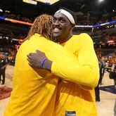 Indiana Pacers forward Pascal Siakam, right, gets a hug from teammate James Johnson after Game 6 against the Milwaukee Bucks in an NBA basketball first-round playoff series, Thursday, May 2, 2024, in Indianapolis. The Pacers won 120-98. (AP Photo/Michael Conroy)