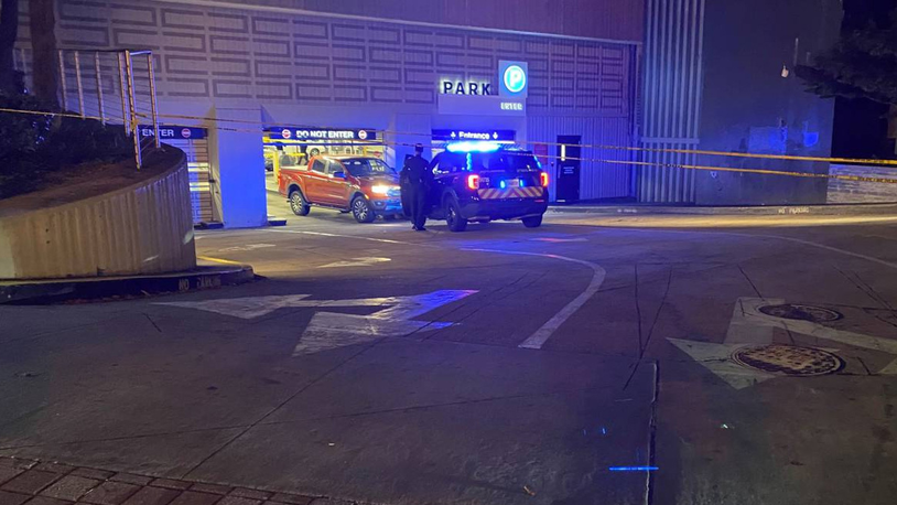 A man died early Thursday after being pinned in a parking deck on Peachtree Street, according to Atlanta police.