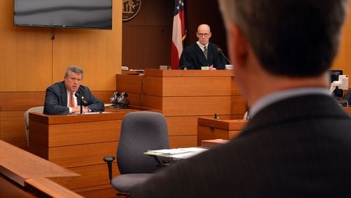 December 18, 2013 Atlanta: Sen. Don Balfour, R-Snellville listens to a question from his attorney Ken Hodges, foreground, Wednesday December 18, 2013. Judge Henry Newkirk, right, is presiding over the case. Balfour is charged with filing false expense claims and theft. Balfour has said he made mistakes on his expense reports but did nothing wrong intentionally. BRANT SANDERLIN /BSANDERLIN@AJC.COM