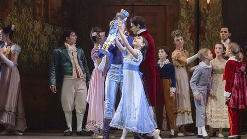 As young Marie, Remi Nakano receives the gift of a nutcracker in Atlanta Ballet’s eponymous version of the holiday classic, making its final run at the Fox Theatre. Contributed by Kim Kenney