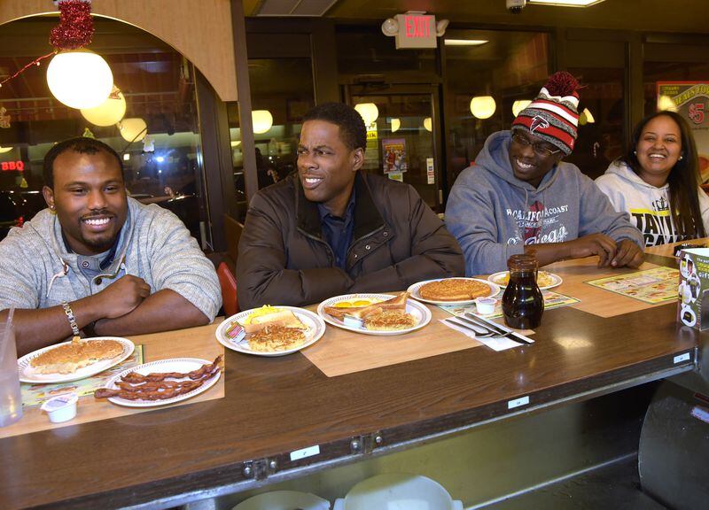 ATLANTA, GA - DECEMBER 09: (EXCLUSIVE COVERAGE) Actor Chris Rock (2nd from left) stops by the Waffle House after the VIP screening of Paramount Pictures' "Top Five" and meets customers Donnell Woods, Daryl T. Johnson II and Semhar Haile on December 9, 2014 in Atlanta, Georgia. (Photo by Rick Diamond/Getty Images for Allied)