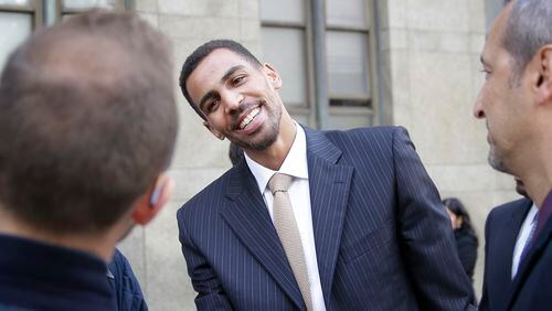 Thabo Sefolosha receives congratulations outside the criminal courts in New York, Friday, Oct. 9, 2015. The Atlanta Hawks’ player was acquitted in a case stemming from a police fracas outside a New York City nightclub. (AP Photo/Seth Wenig)