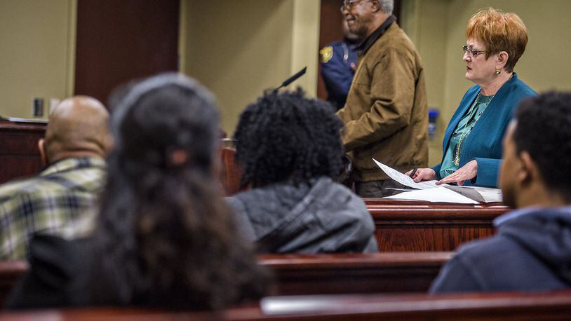 Solicitor Janet Newburg, right, and Clarence Youmans speak in court at DeKalb County State Court’s Traffic Division in Decatur on Wednesday. Money collected from traffic tickets in DeKalb has declined after abolishing Recorders Court. JONATHAN PHILLIPS / SPECIAL