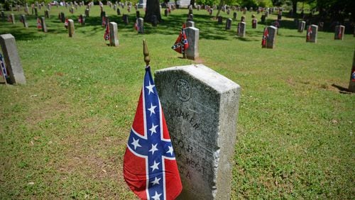 The last Monday in April is designated Confederate Memorial Day in Georgia, which is an official state holiday and state offices are closed for the day.  In this photo, hundreds of Confederate flags adorn graves of soldiers buried in the Confederate section of Oakland Cemetery during Confederate Memorial Day Observance at the Historic Oakland Cemetary in Atlanta on April 26, 2014.