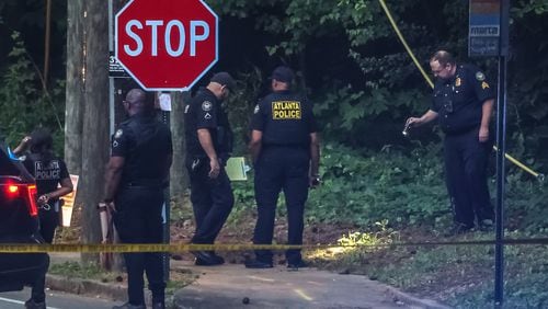 Atlanta police investigate the shooting death of a woman found along Collier Drive in northwest Atlanta early Thursday.