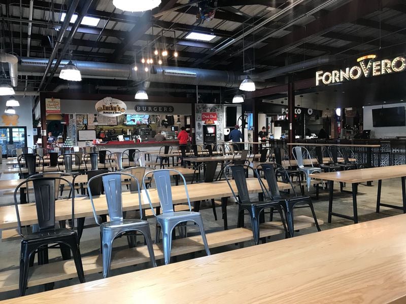 The dining room at Marietta Square Market food hall currently is closed for sit-down dining. LIGAYA FIGUERAS / LIGAYA.FIGUERAS@AJC.COM