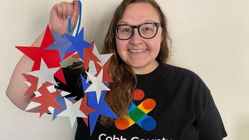 Allyson Eads shares her love of crafting with children at South Cobb Regional Library in Mableton. July 4th wreath craft kits can be picked up from June 28 - July 3.