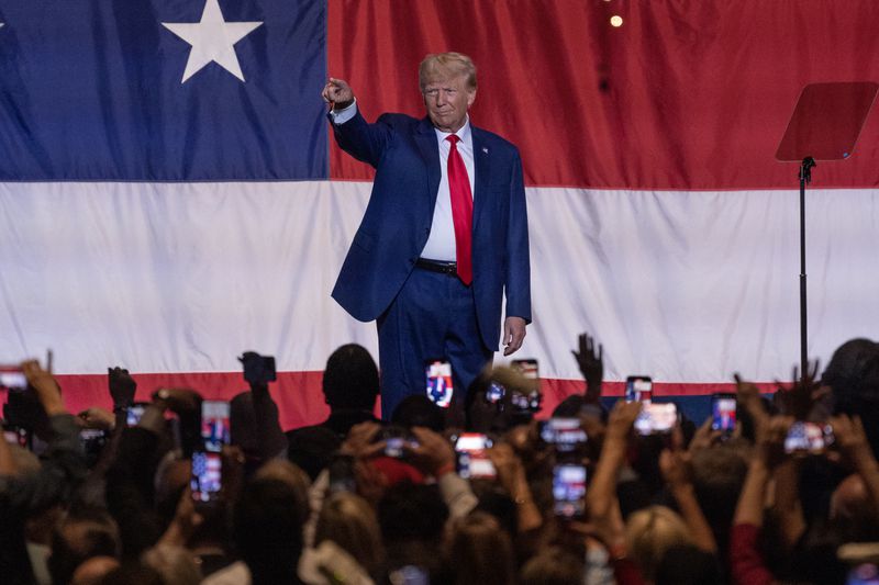 Former President Donald Trumps waves to supporters before speaking during the GOP Convention at the Columbus Georgia Convention & Trade Center on Saturday, June 10, 2023. Fulton Superior Court Judge Scott McAfee has been assigned to oversee the case against Trump and 18 co-defendants, (Natrice Miller/natrice.miller@ajc.com)
