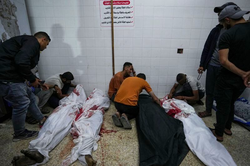 Palestinians react next to the bodies of their relatives who were killed in an Israeli airstrike in Gaza Stirp, at the Al Aqsa hospital in Deir al Balah, Gaza, Sunday, May 5, 2024. (AP Photo/Abdel Kareem Hana)