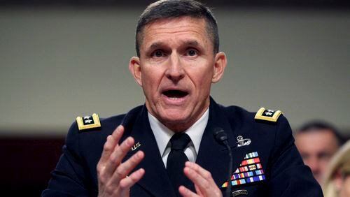 FILE - In this Feb. 11, 2014, file photo, then-Defense Intelligence Agency Director Lt. Gen. Michael Flynn testifies on Capitol Hill in Washington. Flynn resigned as President Donald Trump's national security adviser Monday, Feb. 13, 2017. (AP Photo/Lauren Victoria Burke, File)