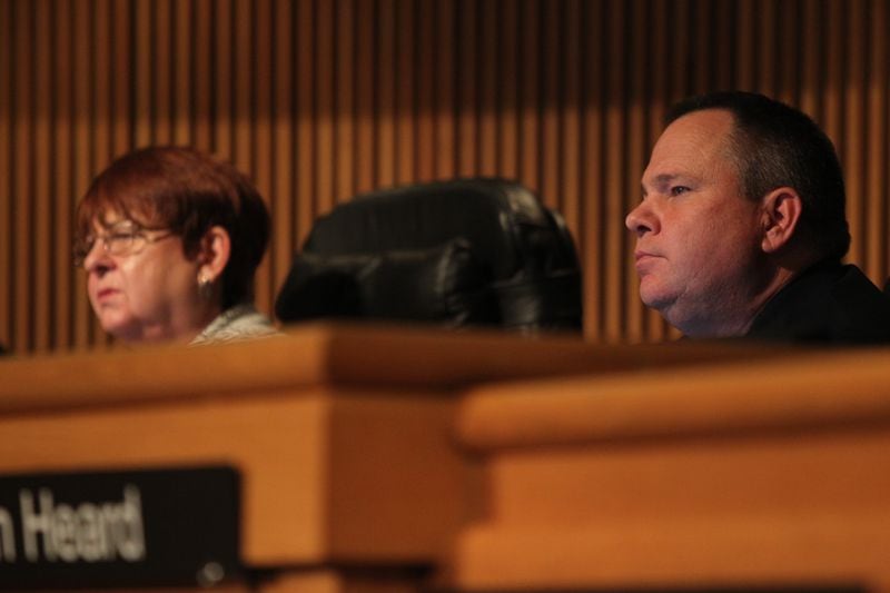 Gwinnett County Commission Chairman Charlotte Nash (left) and Commissioner Tommy Hunter on January 17, 2017. Nash wrote a letter to U.S. Rep. John Lewis, apologizing to him on the board’s behalf after Hunter called Lewis a “racist pig” on Facebook. 