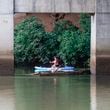 A woman glides along the Chattahoochee River at Don White Memorial Park in Roswell on Thursday, August 3, 2023. (Natrice Miller/ Natrice.miller@ajc.com)