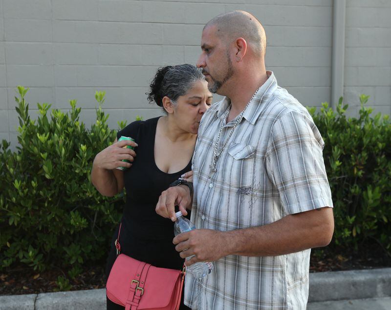 Pulse DJ Ray Rivera and his wife Pattie return to the scene of his workplace - and the worst mass shooting in U.S. history. AJC photo: Curtis Compton