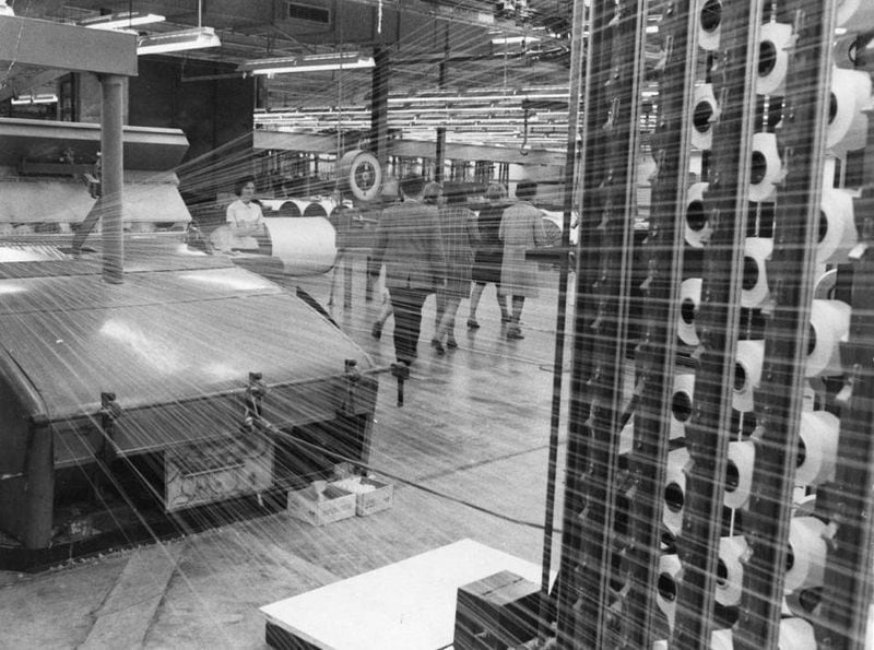 Production, particularly garment industry jobs, moved outside the U.S. because of cheap overseas labor beginning in force in the 1970s. Here, a worker spins string at an unidentified textile plant in Georgia in 1970. (AJC Archive at GSU Library AJCP315-044h)