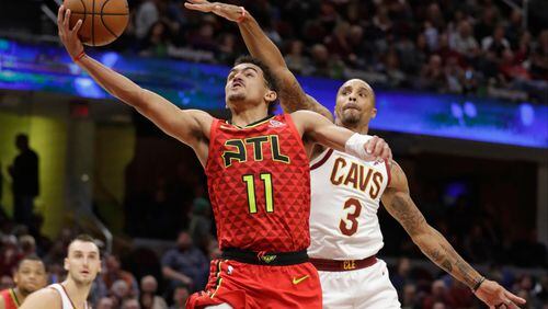 Hawks' Trae Young (11) drives to the basket against the Cleveland Cavaliers' George Hill (3). (AP Photo/Tony Dejak)