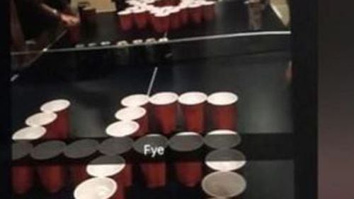A social media photo by Lovett students of cups arranged like a swastika and Star of David in a game of beer pong led to expulsion and suspension.
