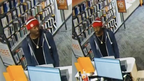 Atlanta police are searching for this man, who is accused of demanding money at gunpoint from a cellphone repair shop worker.