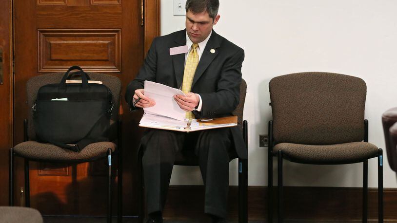Mar. 16, 2016 - Atlanta - Rep. Shaw Blackmon, R - Bonaire, who carried the bill, prepares for the meeting. Two days after stalling an insurance agents minimum commission bill because a majority of the Senate Insurance Committee had a conflict of interest, the panel approved it Wednesday. The committee passed the bill pushed by House Rules Chairman John Meadows, an insurance agent. That, in turn, will likely break the logjam of Senate bills that have been waiting for Meadows to allow on the House floor in the final few days of the session. The panel stalled Meadows’ bill a day after the Atlanta Journal-Constitution raises questions about the legislation and its powerful author. BOB ANDRES / BANDRES@AJC.COM