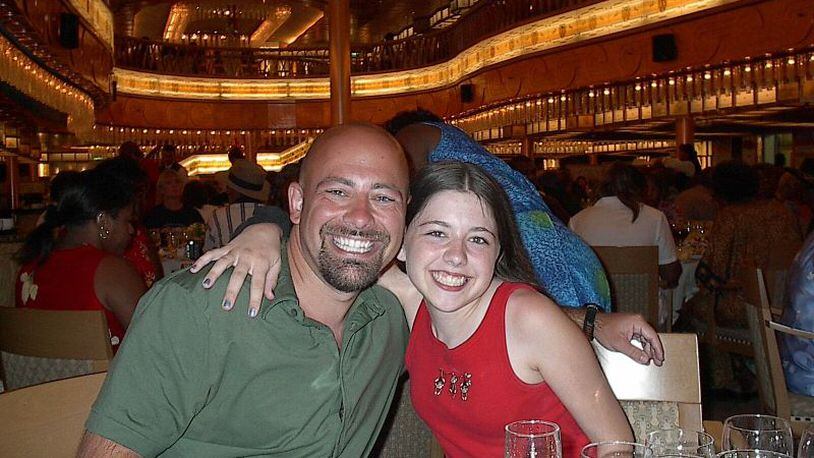 Drew Crecente and daughter, Jennifer (14) on a 7-day cruise of the western Caribbean (Carnival Pride) at dinner on July 23, 2002.