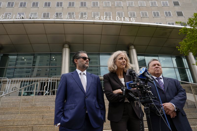 Diana Fabi Samson, center, and John Esposito, right, attorney's for Harvey Weinstein, speak outside Queens criminal court, Thursday, May 9, 2024, in New York. Harvey Weinstein returned to court in New York City as authorities consider an extradition request from California to serve his sentence for a 2022 rape conviction. The 16-year sentence Weinstein received for raping a woman at a Los Angeles film festival in 2013 had been on ice while he served time in New York. (AP Photo/Julia Nikhinson)