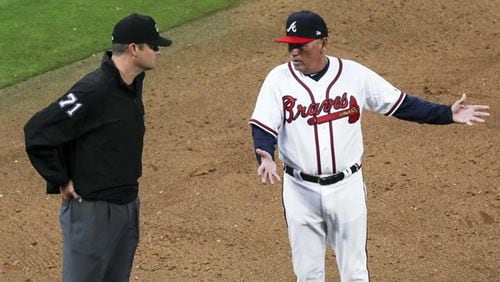 Braves manager Brian Snitker contests a call by the umpire during the ninth inning against the Philadelphia Phillies for the season opener game at SunTrust Park, Thursday, March 29, 2018.