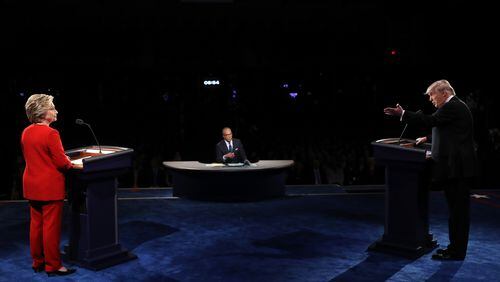 HEMPSTEAD, NY - SEPTEMBER 26: Republican presidential nominee Donald Trump (R) speaks as Democratic presidential nominee Hillary Clinton and Moderator Lester Holt listens during the Presidential Debate at Hofstra University on September 26, 2016 in Hempstead, New York. The first of four debates for the 2016 Election, three Presidential and one Vice Presidential, is moderated by NBC's Lester Holt. (Photo by Joe Raedle/Getty Images)