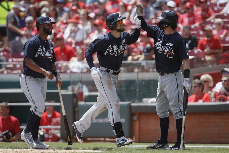  Danny Santana (left) went 4-for-5 with two doubles and a home run Sunday, and Ender Inciarte (center) had five hits including a homer in the Braves' 13-8 slugfest win at Cincinnati. (AP Photo/John Minchillo)