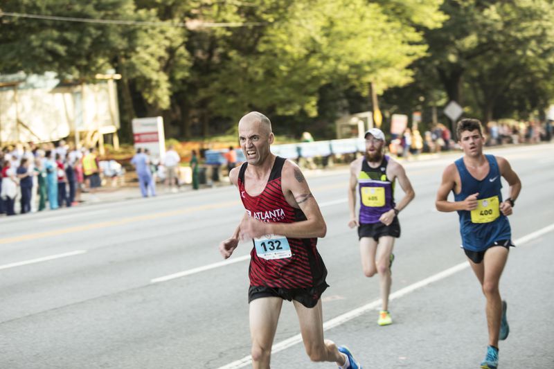Runners in the main event hit the halfway mark in the Peachtree Road Race Chad Rhym/ Chad.Rhym@ajc.com