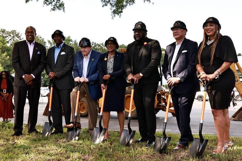 City officials and developers pose for a photo following a press conference announcing the ground breaking for an $800 million mixed-use project in Clayton County on Friday, August 26, 2022.