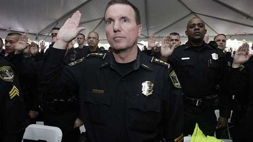 Billy Grogan takes the oath of office in 2009 as the first police chief of the Dunwoody Police Department.