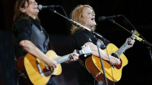 The Indigo Girls - Amy Ray (left) and Emily Saliers - perform during rehearsal for the Boston Pops Fireworks Spectacular in Boston, Tuesday, July 3, 2018. (AP Photo/Michael Dwyer)