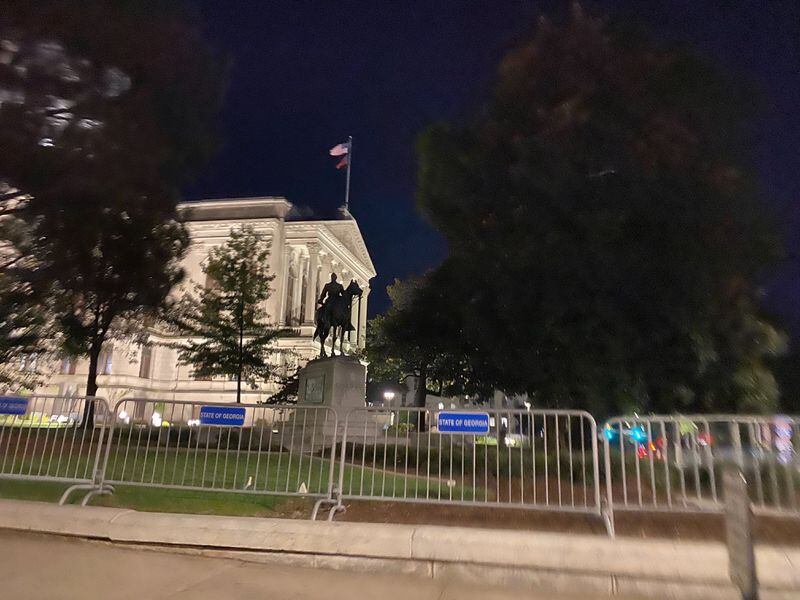 Metal barricades surround the state Capitol on Tuesday night.
