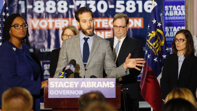 Kurt Kastorf, a member of Stacey Abrams’ litigation team, discusses a lawsuit he plans to file in Dougherty County over absentee ballots. The Abrams campaign held a press conference on Nov. 8, 2018.  Bob Andres / bandres@ajc.com
